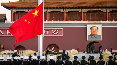 Members of Chinese People's Liberation Army (PLA) attend a flag-raising ceremony at Tiananmen Square with a portrait of late Chinese Chairman Mao Zedong displayed on Tiananmen Gate, in Beijing, China, November 20, 2025. REUTERS/Maxim Shemetov