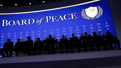 U.S. President Donald Trump sits with Argentina's President Javier Milei, Armenia's Prime Minister Nikol Pashinyan, Hungary's Prime Minister Viktor Orban, Bahrain's Minister of the Prime Minister's Court Shaikh Isa bin Salman bin Hamad Al Khalifa, Morocco's Foreign Minister Nasser Bourita, Azerbaijan's President Ilham Aliyev, Bulgaria's Prime Minister Rosen Zhelyazkov, and Indonesia's President Prabowo Subianto, as the lights go off during a charter announcement for Trump's Board of Peace initiative aimed at resolving global conflicts, alongside the 56th annual World Economic Forum (WEF), in Davos, Switzerland, January 22, 2026. REUTERS/Jonathan Ernst