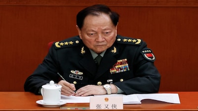 FILE PHOTO: Central Military Commission Vice Chairman Zhang Youxia attends the second plenary session of the National People's Congress (NPC), at the Great Hall of the People in Beijing, China March 8, 2025. REUTERS/Tingshu Wang/File Photo
