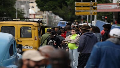 People wait for transportation as Cubans brace for fuel scarcity measures after U.S. tightened oil supply blockade, Havana, Cuba, February 6, 2026. REUTERS/Norlys Perez