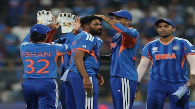 Cricket - ICC Men's T20 World Cup 2026 - Group A - India v United States - Wankhede Stadium, Mumbai, India - February 7, 2026 India's Mohammed Siraj celebrates with teammates after dismissing Andries Gous of the U.S. REUTERS/Francis Mascarenhas