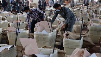 Officials give a final check before dispatching the ballot boxes to voting centres, a day ahead of the national election in Dhaka, Bangladesh, February 11, 2026. REUTERS/Mohammad Ponir Hossain