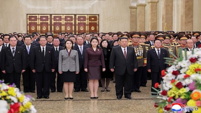 FILE PHOTO: North Korean leader Kim Jong Un, his wife Ri Sol Ju and their daughter Kim Ju Ae visit the Kumsusan Palace of the Sun to mark the New Year, in Pyongyang, North Korea, in this picture released by North Korea's official Korean Central News Agency on January 1, 2026. KCNA via REUTERS/File Photo