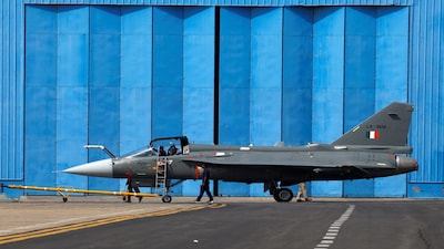Hindustan Aeronautics Limited (HAL) Tejas light combat aircraft is towed by ground crew members at the HAL Airport in Bengaluru, India, February 17, 2026, REUTERS/Priyanshu Singh