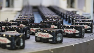 Sealed six packs of Coke Zero sugar free soft drink cans on a conveyor belt at the Coca-Cola Co. factory in Dongen, Netherlands. Photographer: Jasper Juinen/Bloomberg
