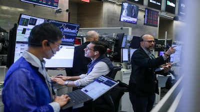Traders work on the floor at the New York Stock Exchange. Photographer: Michael Nagle/Bloomberg