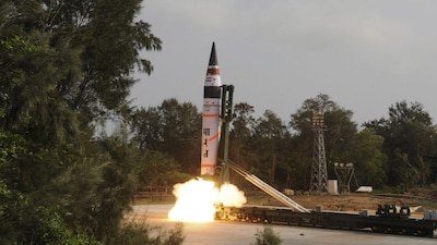 A surface-to-surface Agni V missile is launched from the Wheeler Island off the eastern Indian state of Odisha April 19, 2012. India test-fired the long range missile capable of reaching deep into China and Europe on Thursday, thrusting the emerging Asian power into an elite club of nations with intercontinental nuclear weapons capabilities. A scientist at the launch site said the launch was successful, minutes after television images showed the rocket with a range of more than 5,000 km (3,100 miles) blasting through clouds from the Wheeler Island off Odisha coast. REUTERS/Indian Defence Research and Development Organisation/DRDO/Handout (INDIA - Tags: MILITARY) FOR EDITORIAL USE ONLY. NOT FOR SALE FOR MARKETING OR ADVERTISING CAMPAIGNS