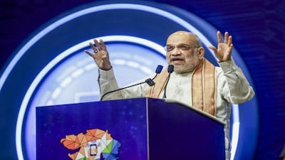 Gandhinagar: Union Home Minister Amit Shah addresses the gathering during the 'Digital Bharat Digital Gujarat' event, in Gandhinagar, Gujarat, Sunday, Feb. 15, 2026. (PTI Photo)(PTI02_15_2026_000154B)