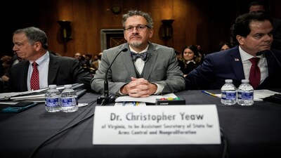 FILE - Christopher Yeaw, center, arrives to a Senate Foreign Relations Committee confirmation hearing on his nomination to be an assistant Secretary of State, Nov. 19, 2025, on Capitol Hill in Washington. (AP Photo/Julia Demaree Nikhinson, File)