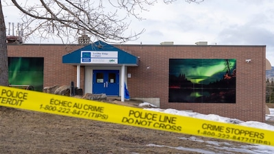 FILE - Police tape surrounds a school in Tumbler Ridge, British Columbia, Canada, Feb. 12, 2026, two days after a mass shooting. (Christinne Muschi/The Canadian Press via AP, File)