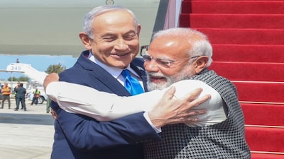 Red-Carpet Welcome at Ben Gurion Airport | Prime Minister Narendra Modi on Wednesday, February 25, arrived in Israel to a ceremonial red-carpet welcome at Ben Gurion International Airport, PTI reported. He was received personally by Israeli Prime Minister Benjamin Netanyahu and his wife, Sara. The two leaders greeted each other with a warm hug and handshake, signalling the close ties between the two countries. A guard of honour was also presented to the Indian leader. (Image: PTI)