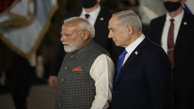 Israel's Prime Minister Benjamin Netanyahu, right, welcomes Indian Prime Minister Narendra Modi as he arrives at Ben Gurion Airport near Tel Aviv, Israel, Wednesday, Feb. 25, 2026. (AP Photo/Leo Correa)