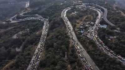 Vehicles stuck in a traffic jam on the Mumbai-Pune Expressway after a gas tanker overturned in the Khandala Ghat section, in Raigad district, Maharashtra. (PTI Photo)
