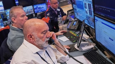 Trader Joseph Stevens, foreground, works with colleagues on the floor of the New York Stock Exchange, Tuesday, Feb. 3, 2026. (AP Photo)