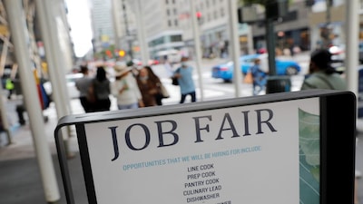 Signage for a job fair is seen on 5th Avenue after the release of the jobs report in Manhattan, New York City, U.S., September 3, 2021. REUTERS/Andrew Kelly