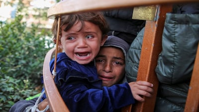 Children cry during the funeral of Palestinian Anas Al-Masri, who succumbed to wounds sustained from an Israeli strike, in Khan Younis in the southern Gaza Strip, November 19, 2024. REUTERS/Hatem Khaled     TPX IMAGES OF THE DAY