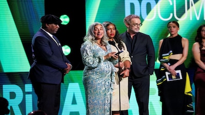 FILE PHOTO: Geeta Gandbhir, Sam Bisbee, Nikon Kwantu and Alisa Payne stand on the stage on the day they receive the award for the Best Documentary of "The Perfect Neighbor" during the Film Independent Spirit Awards at the Hollywood Palladium in Los Angeles, California, U.S., February 15, 2026. REUTERS/Mario Anzuoni/File Photo
