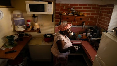 Lourdes Barberia, 60, drinks coffee at home during a mass blackout across most of the country, in Havana, Cuba March 4, 2026. REUTERS/Norlys Perez