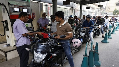 A man refuels his motorcycle at a fuel station, as concerns grow over fuel supplies following U.S.-Israel conflict with Iran, in Dhaka, Bangladesh, March 6, 2026. REUTERS/Mohammad Ponir Hossain