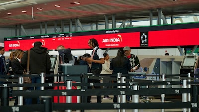 FILE PHOTO: Travelers check in at the Air India counter amid the U.S.-Israel conflict with Iran, inside Terminal 4 at John F. Kennedy (JFK) International Airport in New York City, U.S., March 2, 2026. REUTERS/Bing Guan/File Photo