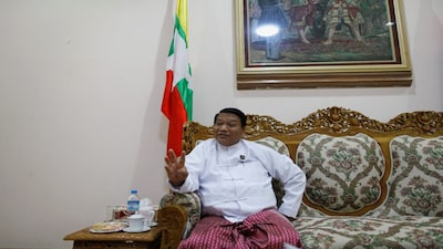 FILE PHOTO: Myanmar's Minister of Immigration and Population Khin Yi talks during an Reuters interview at his office in Naypyitaw June 10, 2013. Picture taken June 10, 2013. REUTERS/Soe Zeya Tun/File Photo