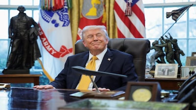 U.S. President Donald Trump reacts as he takes questions from reporters during an event to sign an executive order creating an anti‑fraud task force headed by U.S. Vice President JD Vance in the Oval Office at the White House in Washington, D.C., U.S., March 16, 2026. REUTERS/Jonathan Ernst