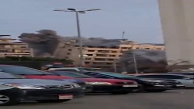 A building collapses after it was struck by an Israeli airstrike, following an escalation between Hezbollah and Israel amid the U.S.-Israeli conflict with Iran, in Beirut's Bachoura neighbourhood, Lebanon, March 18, 2026, in this still image obtained from social media video. Social Media/via REUTERS  THIS IMAGE HAS BEEN SUPPLIED BY A THIRD PARTY. NO RESALES. NO ARCHIVES. NEWS USE ONLY