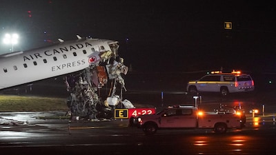 Damage to an Air Canada Express jet that had collided with a ground vehicle at New York's La Guardia Airport in Queens, New York, U.S. March 23, 2026.  REUTERS/Bing Guan