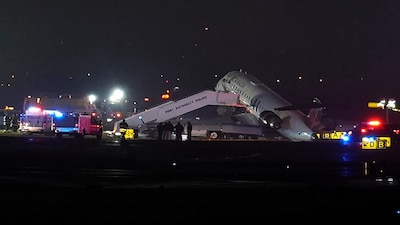 An Air Canada Jet sits on the runway at LaGuardia Airport, Monday, March 23, 2026, after colliding with a Port Authority vehicle in New York. (AP Photo/Ryan Murphy)