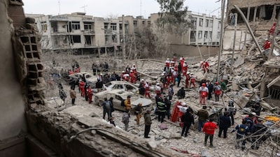 Emergency personnel work at the site of a strike on a residential building, amid the U.S.-Israeli conflict with Iran, in Tehran, Iran, March 16, 2026. Majid Asgaripour/WANA (West Asia News Agency) via REUTERS ATTENTION EDITORS - THIS PICTURE WAS PROVIDED BY A THIRD PARTY