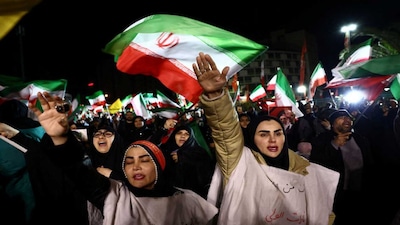People attend an anti-US and Israeli rally, amid the US-Israeli conflict with Iran, in Tehran. (Reuters)