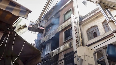 **EDS: SCREENGRAB VIA PTI VIDEOS** New Delhi: Rescue operations underway after a fire broke out in a residential building near Palam Metro station, in New Delhi, Wednesday, March 18, 2026. (PTI Photo)(PTI03_18_2026_000027B)