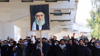 Protesters supporting Iraqi Shi'ite armed groups demonstrate near the entrance of the Green Zone after the killing of Iran's Supreme Leader Ayatollah Ali Khamenei, in Baghdad. (Reuters)