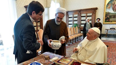 Pope Francis is shown a gift as he receives Ayatollah Alireza Arafi. (File Photo: Reuters)
