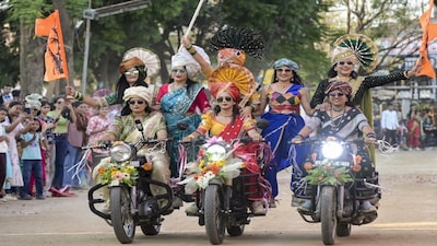 Nagpur: Women dressed in traditional attire take part in a bike rally on International Women's Day, in Nagpur, Sunday, March 8, 2026. (PTI Photo) (PTI03_08_2026_000436B)