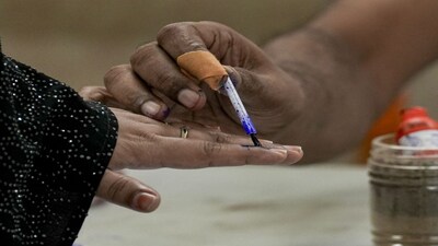 Kolkata: A polling official marks a voter's finger with indelible ink during the second and final phase of the West Bengal Assembly elections, at a polling station in Kolkata, Wednesday, April 29, 2026. (PTI Photo/Manvender Vashist Lav)(PTI04_29_2026_000150B)