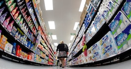 A shopper walks down an aisle in a newly opened Walmart Neighborhood Market in Chicago in this September 21, 2011 file photo. U.S. consumer confidence rebounded to its highest level in more than a year in March as optimism about jobs and income overcame higher prices at the gasoline pump, said a survey released on March 30, 2012. Picture taken September 21, 2011.  REUTERS/Jim Young/Files  (UNITED STATES - Tags: BUSINESS)