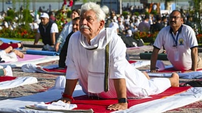 J&K LG Manoj Sinha Leads Yoga Day Event in Srinagar | Jammu and Kashmir Lieutenant Governor Manoj Sinha led celebrations at SKICC in Srinagar. He said yoga helps maintain physical and mental health and encouraged people to adopt healthier lifestyles. (Image: PTI)