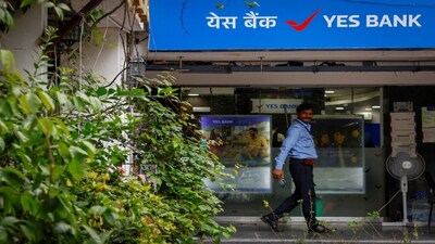A private security guard stands outside a branch of Yes Bank in New Delhi, India, August 30, 2024. REUTERS/Ainnie Arif