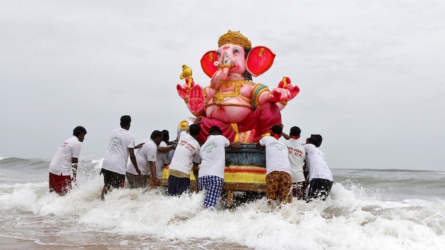 Devotees carry an idol of the Hindu god Ganesh, the deity of prosperity, into the Bay of Bengal for its immersion during the ten-day-long Ganesh Chaturthi festival in Chennai. (Image Reuters file)