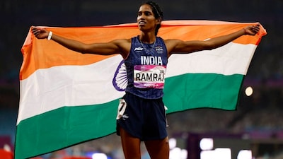 Asian Games - Hangzhou 2022 - Athletics - Olympic Sports Centre Stadium, Hangzhou, China - October 3, 2023 India's Vithya Ramraj celebrates after winning bronze in the Women's 400m Hurdles Final REUTERS/Tingshu Wang