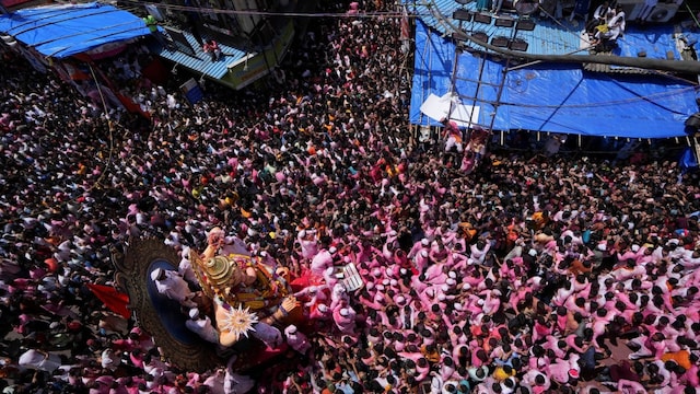 Devotees carry an idol of the Hindu god Ganesh, the deity of prosperity, for immersion on the last day of the Ganesh Chaturthi festival in Mumbai. (Image Reuters file)