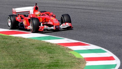 FILE PHOTO: Formula One F1 - Tuscan Grand Prix - Mugello, Scarperia e San Piero, Italy - September 13, 2020 Mick Schumacher drives the Ferrari F2004 of his father Michael Schumacher during a display run before the race Pool via REUTERS/Jennifer Lorenzini/File Photo