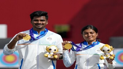 Nagoya: India's Sahil Jadhav, left, and Chikitha Taniparthi during the medals ceremony winning the compound mixed team archery gold medal match against Korea during the 20th Asian Games, in Nagoya, Japan, Wednesday, Sept. 30, 2026. (PTI Photo/Arun Sharma) (PTI09_30_2026_000034B)