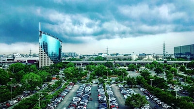9. Gurugram: The NCR city ranked ninth with INR 2.23 lakh crore in wealth across five dollar billionaires, led by Nirmal Kumar Minda and family. (Image: Canva)