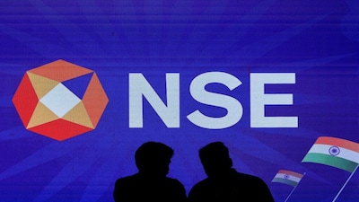 FILE PHOTO: People talk inside the National Stock Exchange (NSE) in Mumbai, India, August 14, 2025. REUTERS/Francis Mascarenhas/File Photo