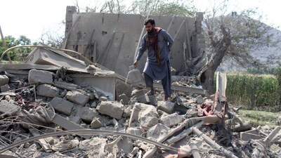A man retrieves belongings from the debris of a house that was damaged in what the Taliban said was a Pakistani airstrike in Kunar province, Afghanistan, September 21, 2026. REUTERS