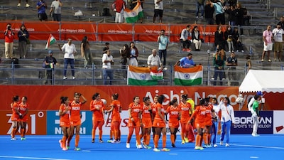 Asian Games - Aichi-Nagoya 2026 - Field Hockey - Women - Gold Medal Match - China v India - Gifu Prefectural Green Stadium, Kakamigahara, Japan - October 2, 2026 India players and fans celebrate after winning the gold medal match REUTERS/Manami Yamada