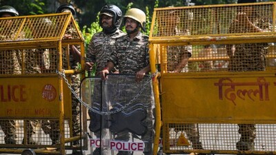 New Delhi: Security personnel stand guard behind barricades amid heightened security arrangements during a protest call by Cockroach Janta Party (CJP) against Chief Election Commissioner (CEC) Gyanesh Kumar over alleged electoral roll irregularities, in New Delhi, Saturday, Oct. 10, 2026. (PTI Photo/Karma Bhutia)(PTI10_10_2026_000166B)