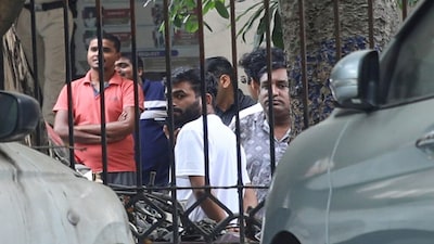 Abhijeet Dipke, center, founder of the Cockroach Janta Party, stands on the court premises following his release in New Delhi, India, Sunday, Oct. 11, 2026. (AP Photo/Prabhat Mehrota)